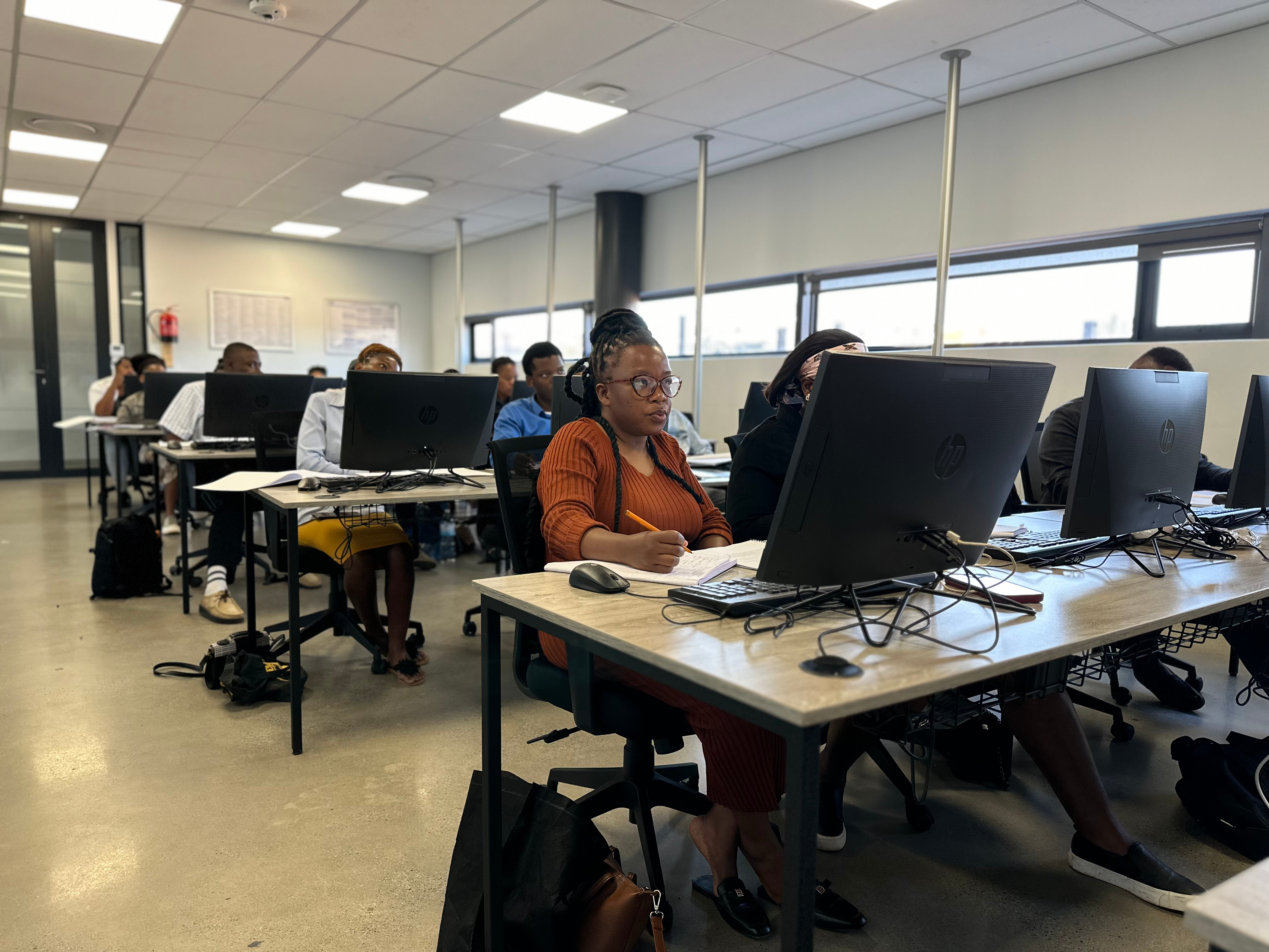 Learners participating in technology training